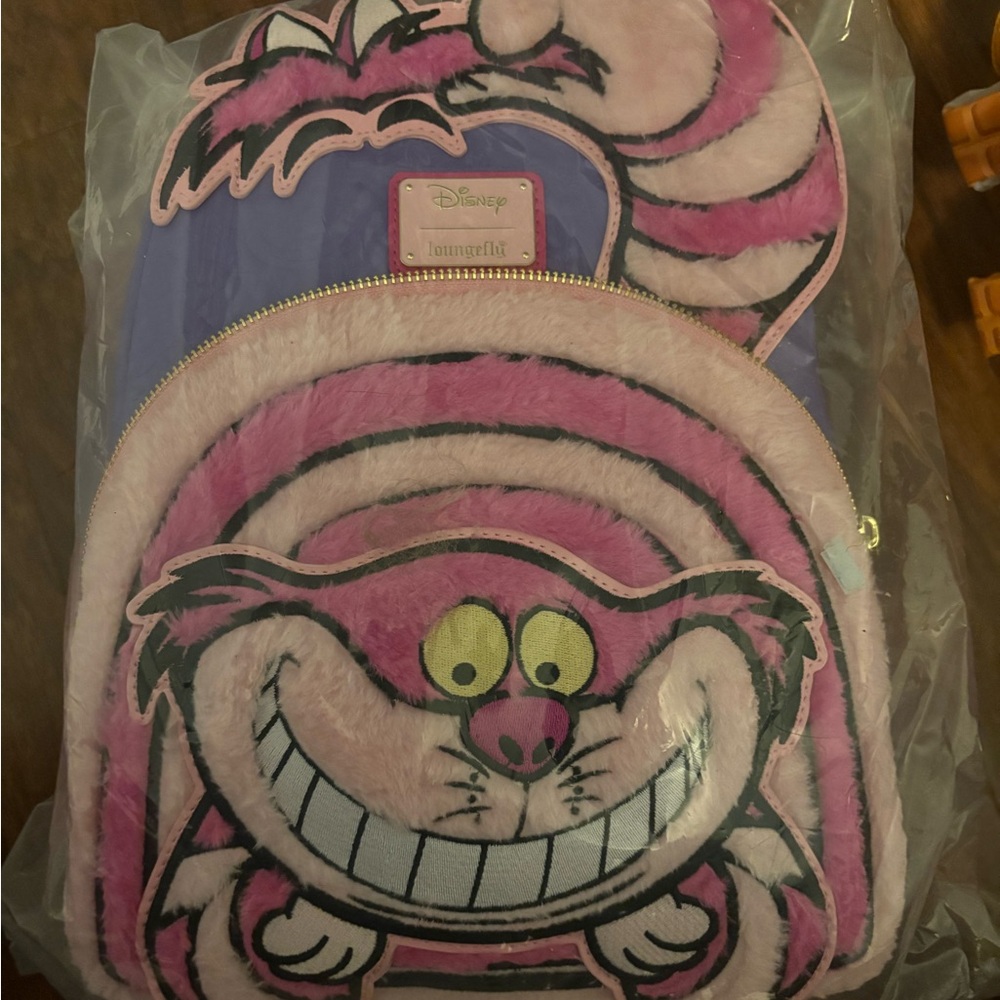 Loungefly Pink and Purple Cheshire Cat Backpack